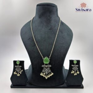 Trinetra Green Oxidized Necklace Set with green teardrop stone, ghungroo detailing, and earrings – Swisara
