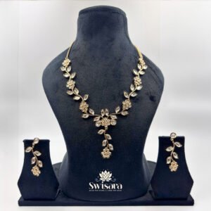 Aangan Leaf Kundan Set with antique gold finish, floral and leaf motifs, and matching earrings – Swisara