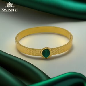 Emerald Gaze Anti-Tarnish Bangle with gold-tone textured finish and green cabochon – Swisara